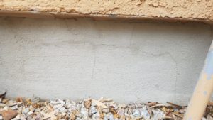Foundation Patchwork Trapping Moisture on Backside, with Shrinkage Cracking. Patch is not attached.